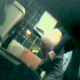 A low-quality video of an unsuspecting girl peeing while sitting on a toilet in a bathroom rigged with a hidden camera. Audio is present, but sketchy.
